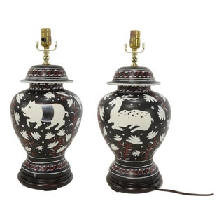 A Pair of Vintage Brunschwig & Fils Cadiz Table Lamps - Black and Cream Ceramic With Boar and Deer Motifs For Sale