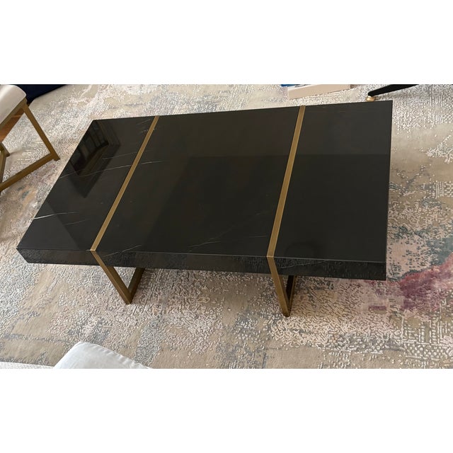 Custom imported from Turkey, Modern LAGU coffee table featuring a striking single-slab Alexander Black marble top,...