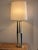 Vintage 1980's tall metal table lamp, with a stylish combination of brass, and black and white enamel finishes, along with...