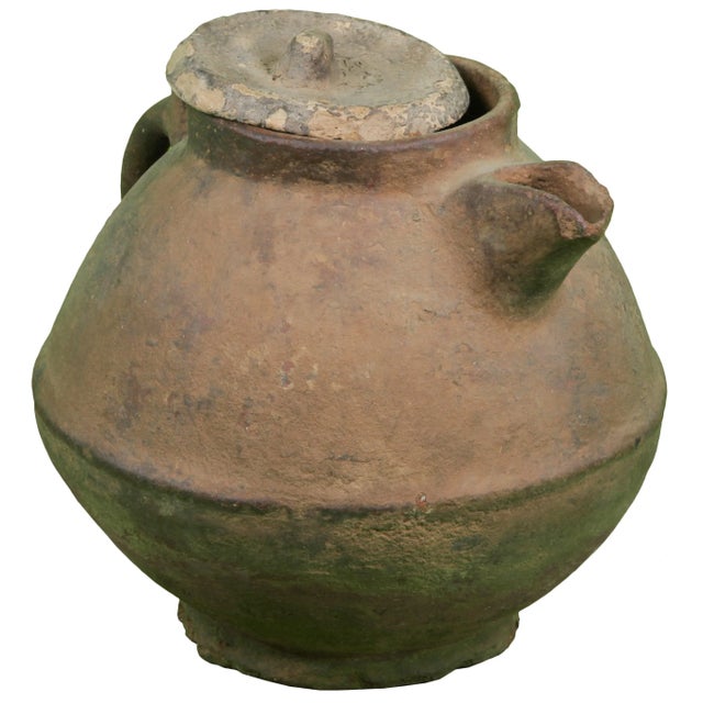 One-of-a-kind clay storage vessel used by Berber tribes to store water. Intricate and shape and ornate tattoo design. This...