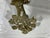 Add warmth and Hollywood Regency flair to your gallery wall or dining room with this solid brass double-arm candle sconce....