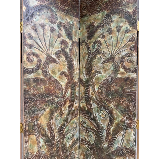 This monumental vintage folding screen features two stylized peacocks as the central motif, surrounded by elaborate...