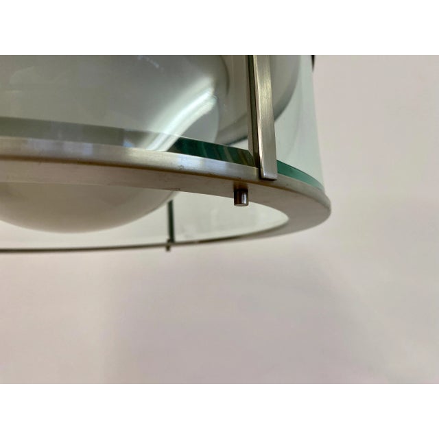 Suspension ceiling light by Pia Guidetti Crippa. Manufactured by Lumi. Brushed aluminium body. Glass diffuser. Labelled....