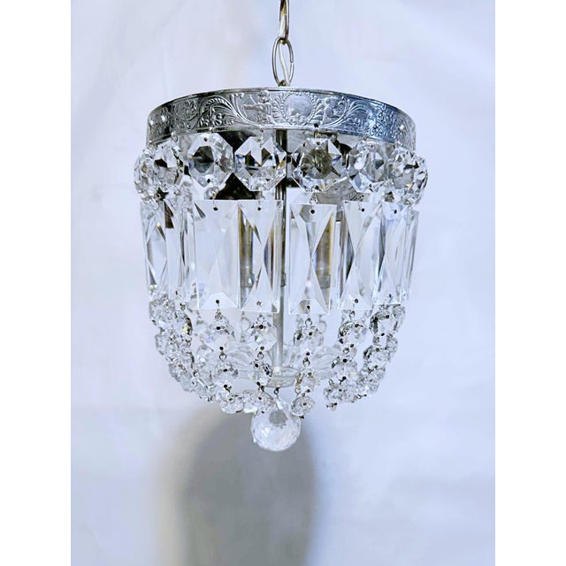 Silver plated basket chandelier with 30% leaded A-chain crystals. Rewired and restores and it has 2 Edison based sockets...