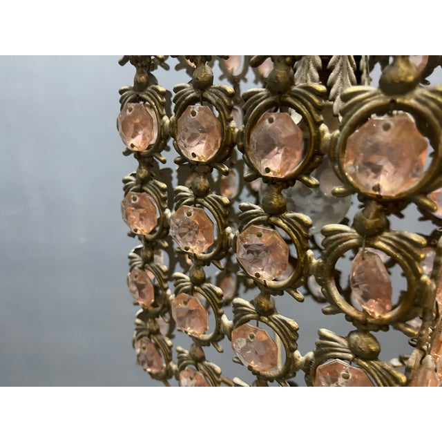 Pink crystal and bronze pendant light elegant vintage-style pendant light featuring a finely crafted bronze frame adorned...