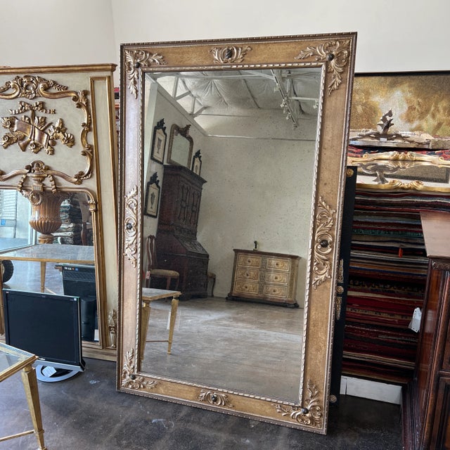 Hand carved and hand painted mirror from Italy. The glass made to look like as antique.