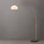 Sleek and modern, the Morelli Simple Arc Floor Lamp features a gracefully curved arm in matte black with weathered brass...