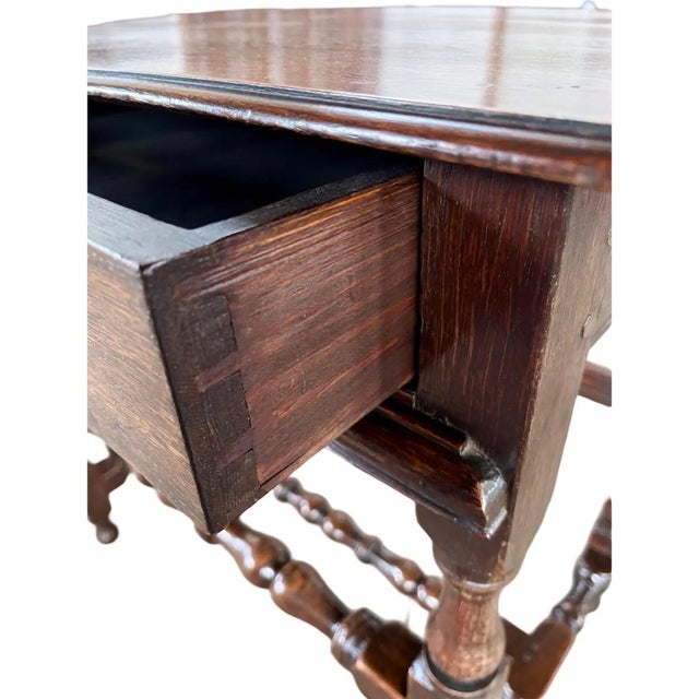 Side table handmade in England in the early 1700s using oak and peg construction. The table is a beautiful example of...