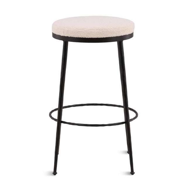 Modern and charming simple round bar stool with ivory boucle upholstered seat and black matte hand forged iron base....