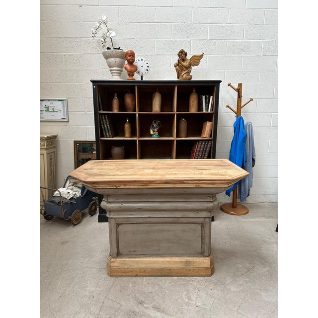 This counter has been completely restored. Its top is made of solid oak. It has two small functional drawers at the back....