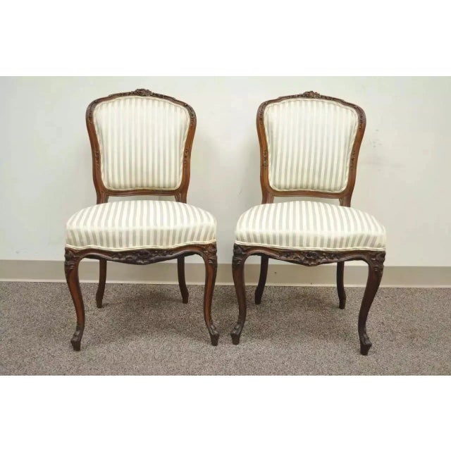 Antique French Victorian Louis XV Style Carved Walnut Side Chairs - a Pair. Item features carved cabriole legs, heavy...