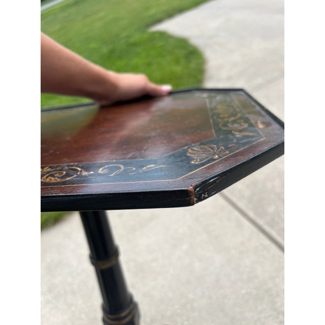 Antique English 1820's Regency Period Ebonized Gueridon With Octagonal Painted Top An English Regency period ebonized...