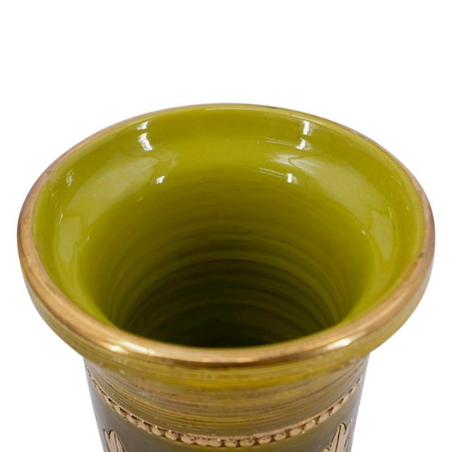 A 1960's Mid-Century Modern Italian ceramic vase designed by Aldo Londi for Bitossi in Italy. The vase features a glossy...