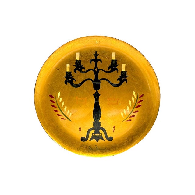 This vintage tray by Georges Briard features a striking candelabra design against a gold background. Ideal for collectors...