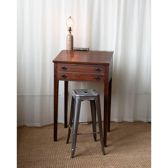 A charming tall Scandinavian pine desk with a clean, minimalist silhouette and warm natural patina. Featuring a hinged...