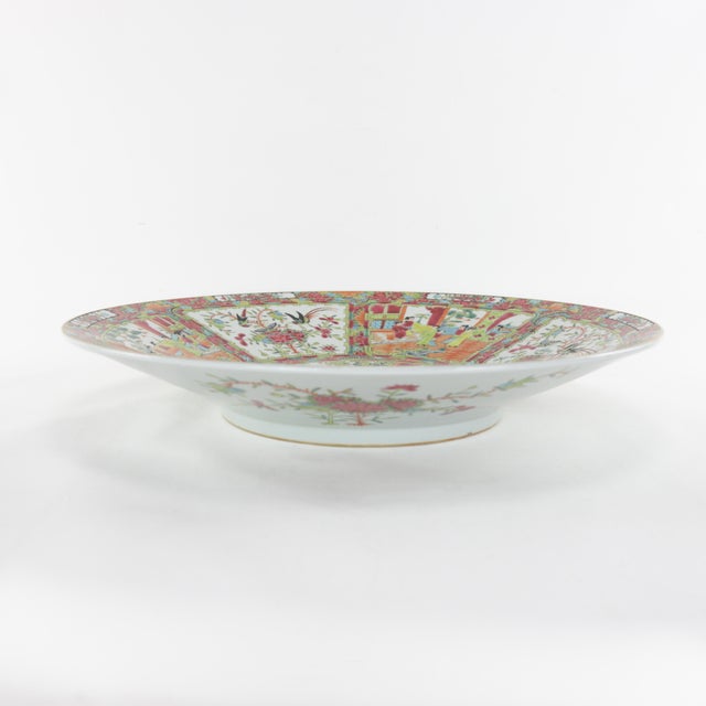 Early 20th Century Export Porcelain Cantonese Famille Rose Plate. The interior and exterior of this plate are filled with...