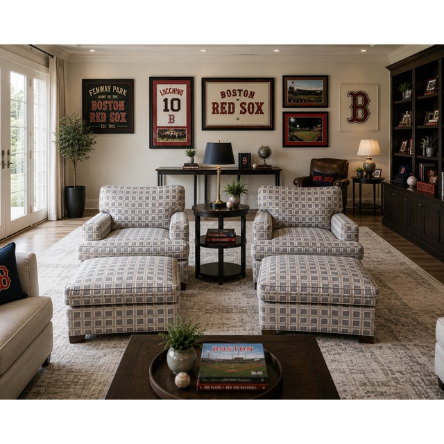 A handsome and exceptionally comfortable pair of custom lounge chairs accompanied by their matching ottomans. These...