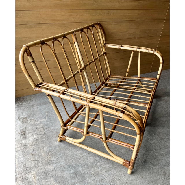 Lovingly restored early 20th century bamboo settee ready for your custom upholstery. Weather sealed for porch use. Seat...