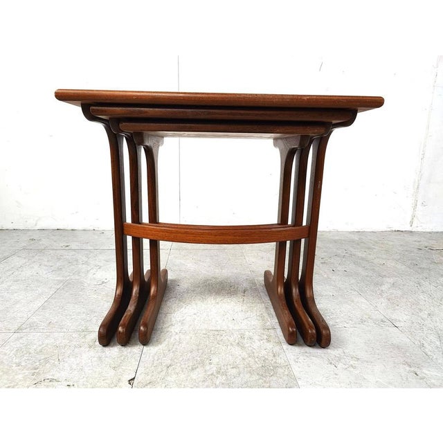 G plan nest of 3 tables from the e gomme furniture manufacturer. Each top is teak veneered and finished with solid teak...