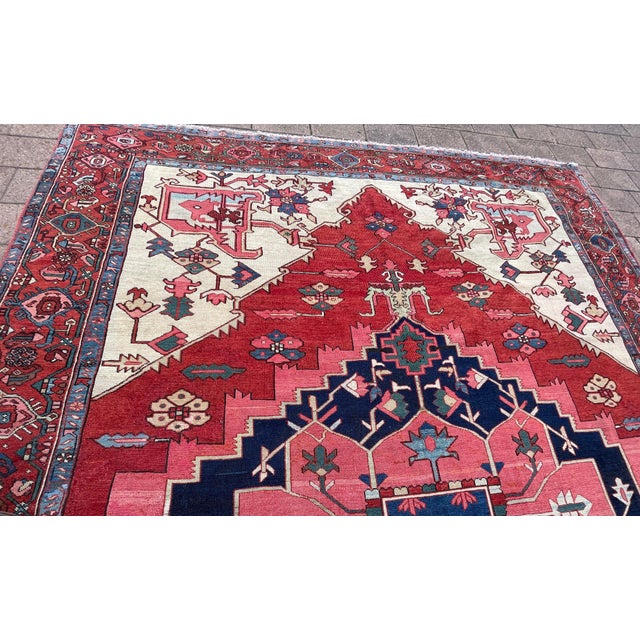 Persian Serapi rugs, hailing from the Iranian province of Eastern Azerbaijan and the encompassing Heriz region, hold a...