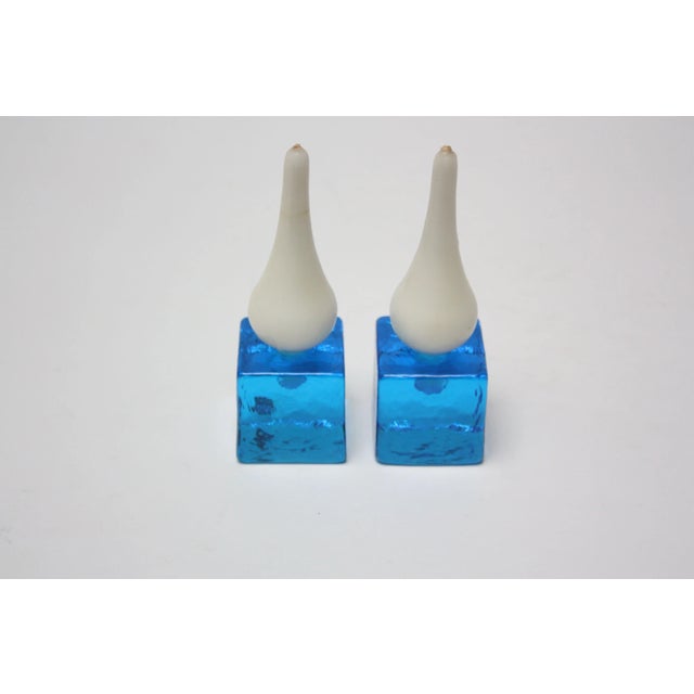 Small, blown glass cube candle holders by Konst Glashyttan of Urshult, Sweden in striking azure. The texture, shape and...