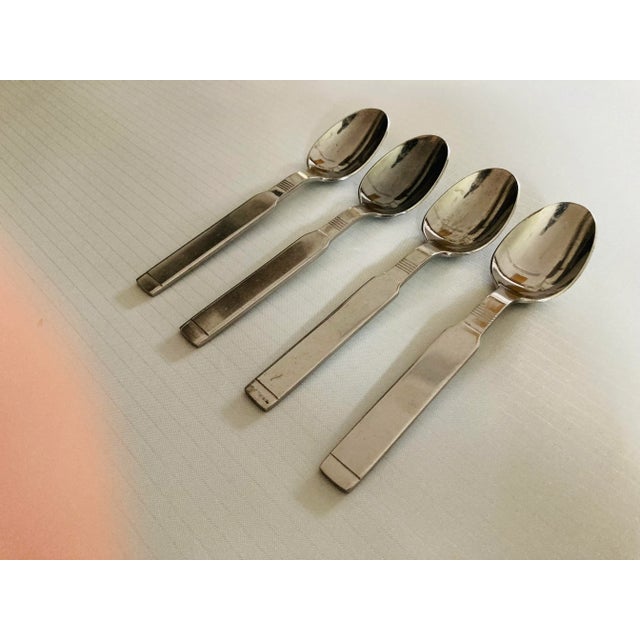 Midcentury stainless set of 4 table spoons 7.25"L, makers mark reads " Stanley Roberts Korea" in Oblique Pattern , they in...