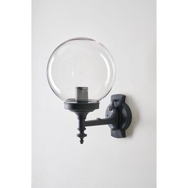 Classic outdoor wall lamp produced by the Italian lighting manufacturer Lothus. It combines a traditional cast metal wall...