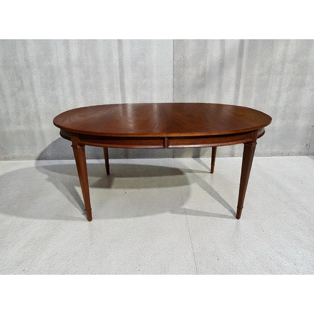 An authentic Drexel Triune dining table from the 1960s, beautifully restored to highlight its timeless Mid-Century Modern...