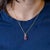 A 3.25-carat pink tourmaline pear sits at the centre of this solid 14K yellow gold pendant, framed by eighteen earth-mined...