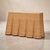 Handwoven rattan console table with a warm honey finish. Skirted undulating folds mimic draped fabric. Wonderful piece for...