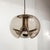 Timeless smoked glass pendant light ‘Futura’ by Peill & Putzler, Germany, wave pattern on the underside of an 10.0″ globe,...