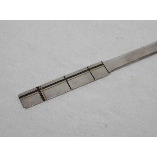 Elegant letter opener from the time of Art Deco, Bauhaus, silver, decorative black / gold. It is hallmarked with WMF Ikora...
