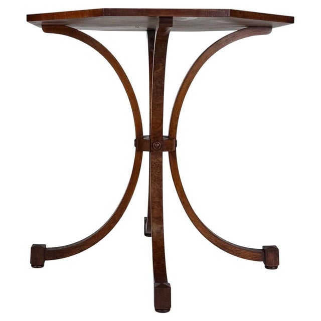 An exceptionally well-crafted 20th-century octagonal side table, beautifully executed in richly figured burr walnut and...