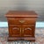 A vintage Thomasville Collector's Cherry commode style nightstand having one dovetailed drawer over a two door cabinet,...