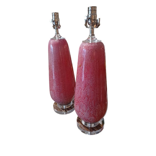Vintage pink and hold maurano style table lamps. Lamps have been redone with lucite bases and necks.