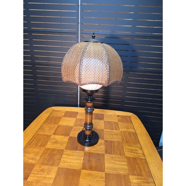 Has a white globe and has tropical or boho vibes. The wicker shade is 14.5" wide x 9" high. The base is 6.25" wide. Photos...