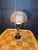 Has a white globe and has tropical or boho vibes. The wicker shade is 14.5" wide x 9" high. The base is 6.25" wide. Photos...