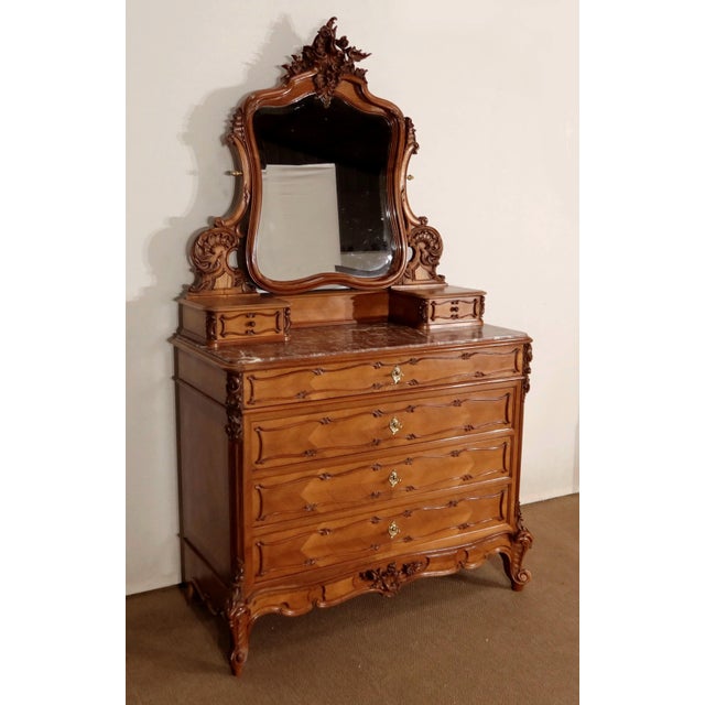 Beautiful chest of drawers in a solid walnut, surmounted by an important psyche, produced by the Nantes house Guinand-...