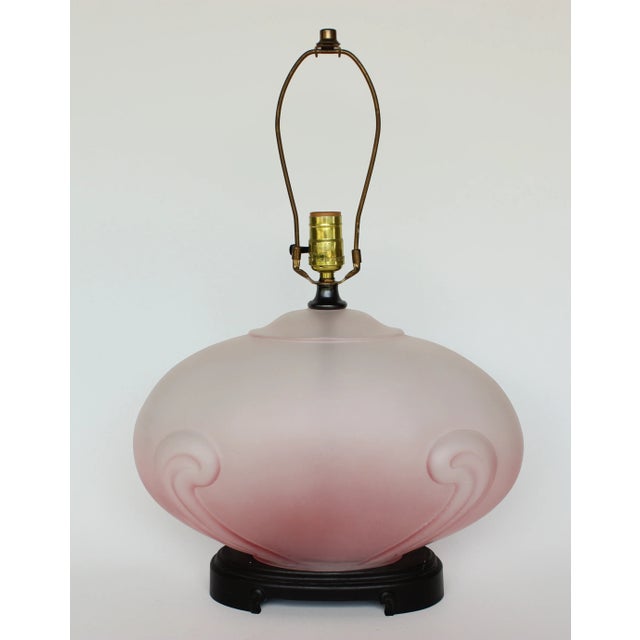 This is a vintage molded glass table lamp with an applied matte finish in shades of pink. It was a black, Asian style base...
