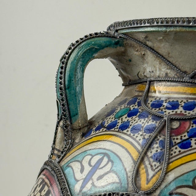 Large Moroccan vase handcrafted in terracotta in classic form hand decorated on floral designs in distinctive...