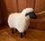 Lalanne style carved wood sheep with off-white sheepskin.