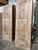 A gorgeous hand-carved wooden door with a sand-washed earthy patinas with warm honey-brown wood tones, the door is divided...