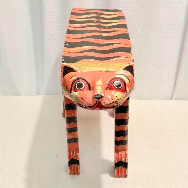 At Turtle & Crane, we turn the past into stunning décor for today, and this artist signed folk art tiger footstool does...