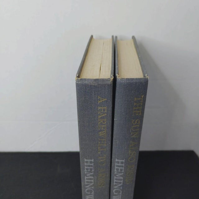 2 Novels by American Novelist Ernest Hemingway Published by Charles Scribner's Sons, New York A Farewell to Arms 1957...