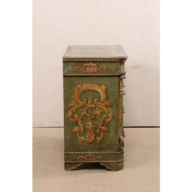 A Central European chest, with its original decorative paint, from the 19th century. This antique chest of drawers from...