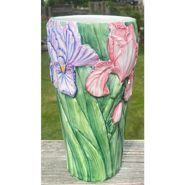 Bright colored majolica Italian vase with pink and purple Irises.