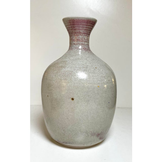 Lovely organic studio pottery vase in speckled slate color over accents of red sanger de boeuf style at top and as drip...