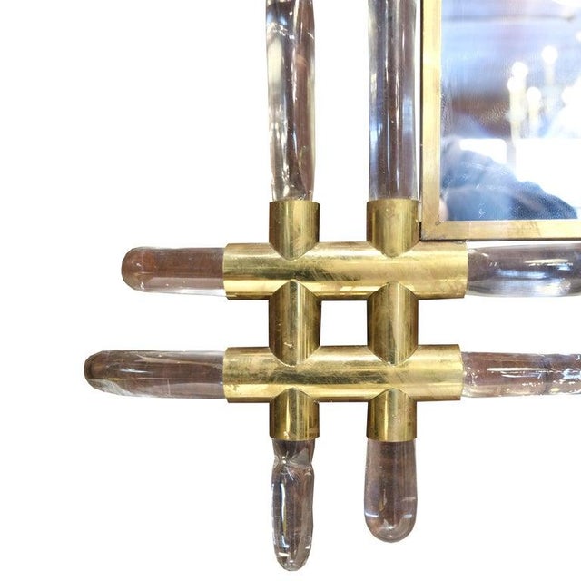 French brass and lucite faux bamboo wall mirror from Paris. This mirror is spectacular and has a big presence. The lucite...