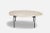 La terra large occasional table by agnes morguet materials: metal, ivory travertine dimensions: d 54 x w 95 x h 36 cm the...
