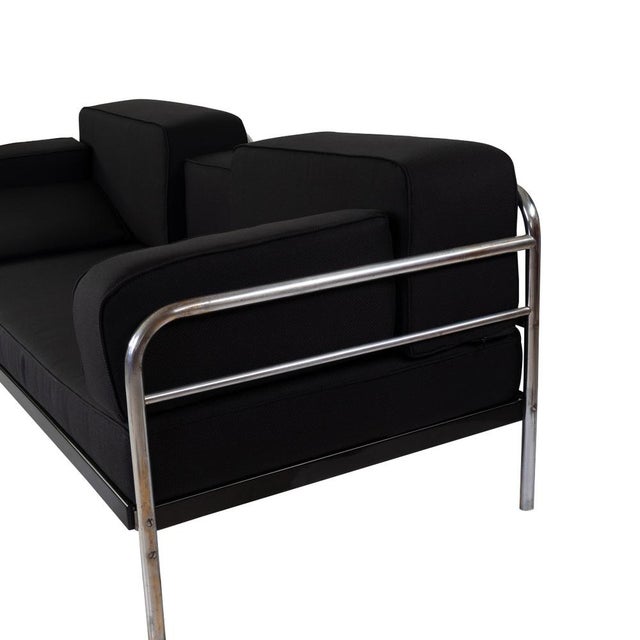 The frame of the couch consists of chrome-plated steel tube. The upholstery was completely renewed and re -moved with a...